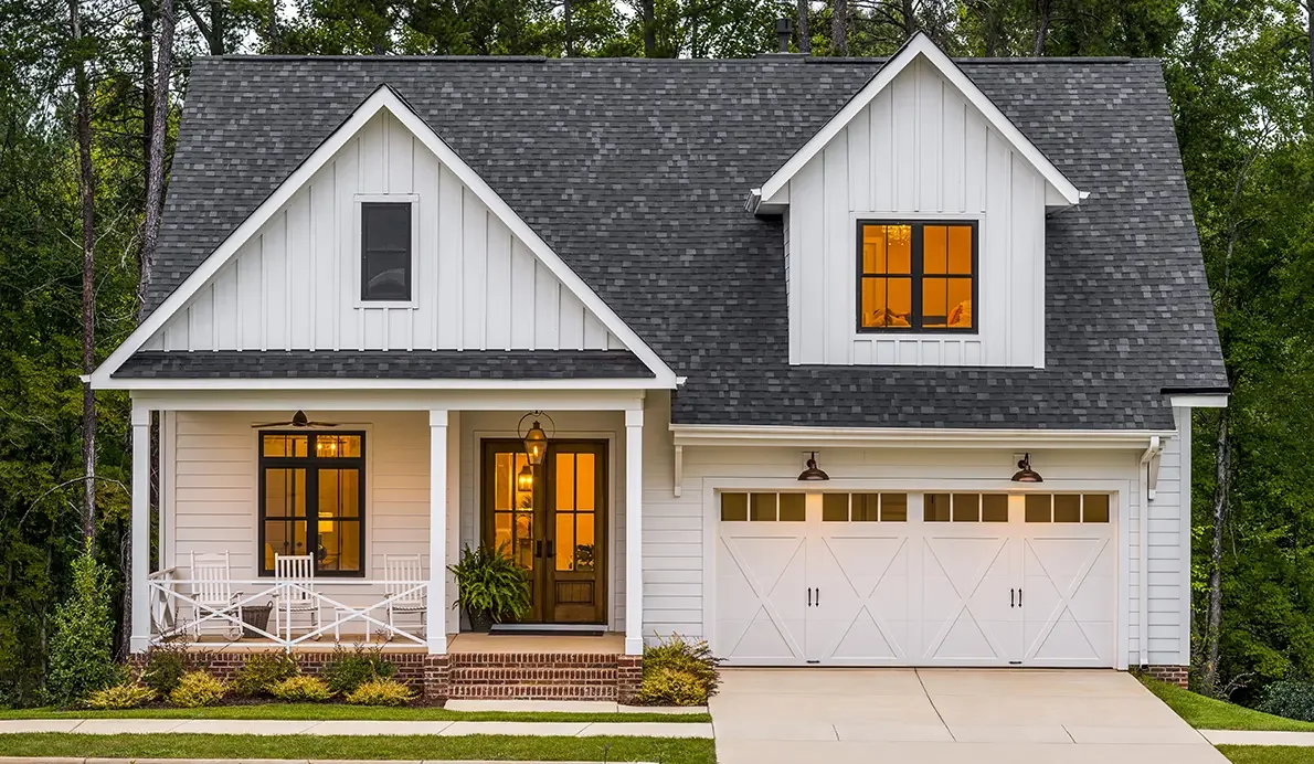 Carriage-house garage door with windows on a classic home.